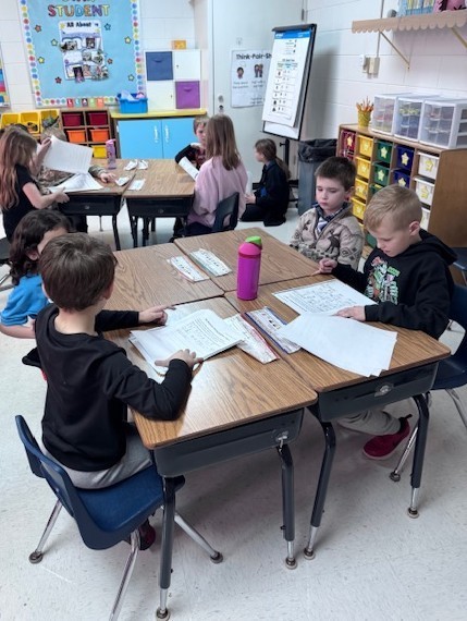 students reading to each other