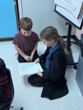 students reading to each other