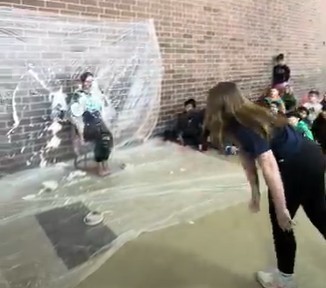 Chloe C throwing a pie