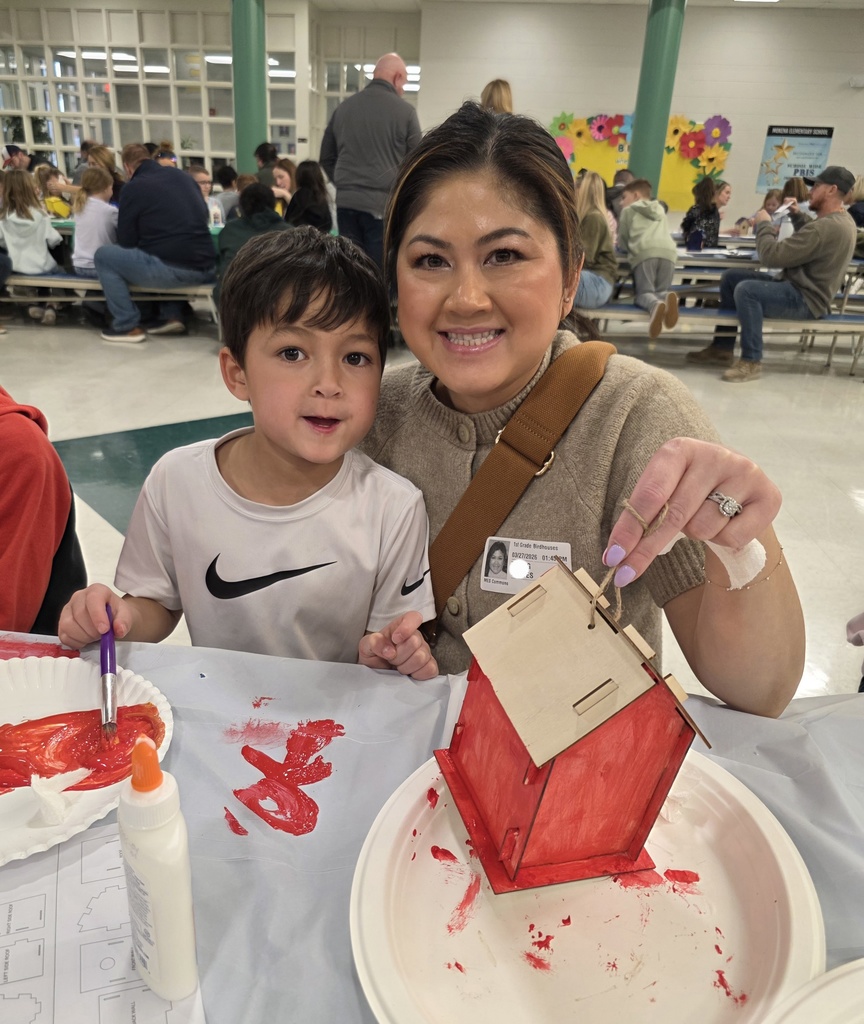 first graders making a birdhouse with an adult