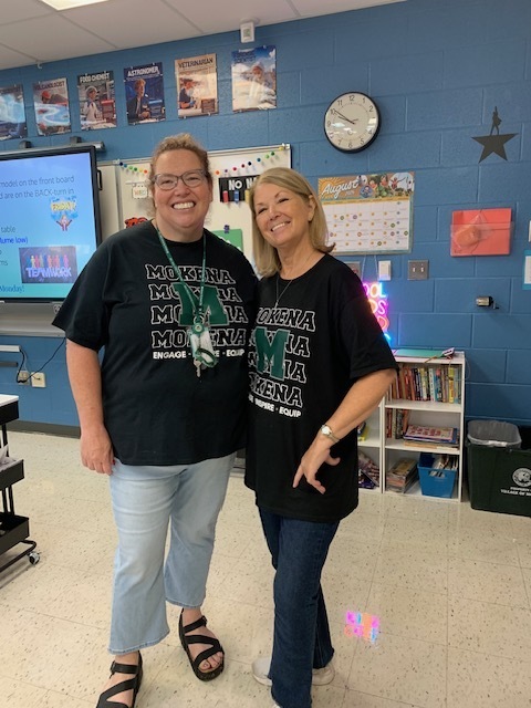 staff members with the district tshirt