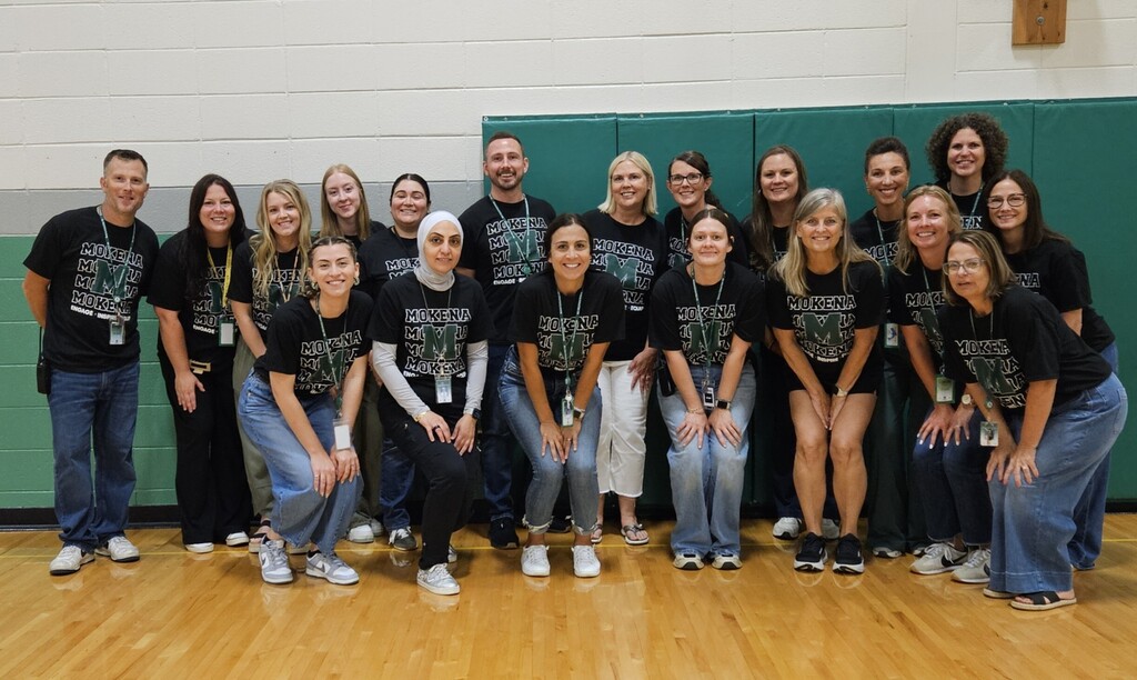 staff members with the district tshirt