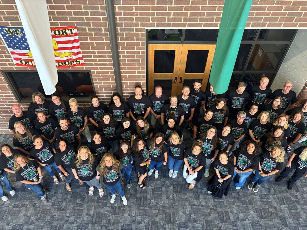 staff members with the district tshirt