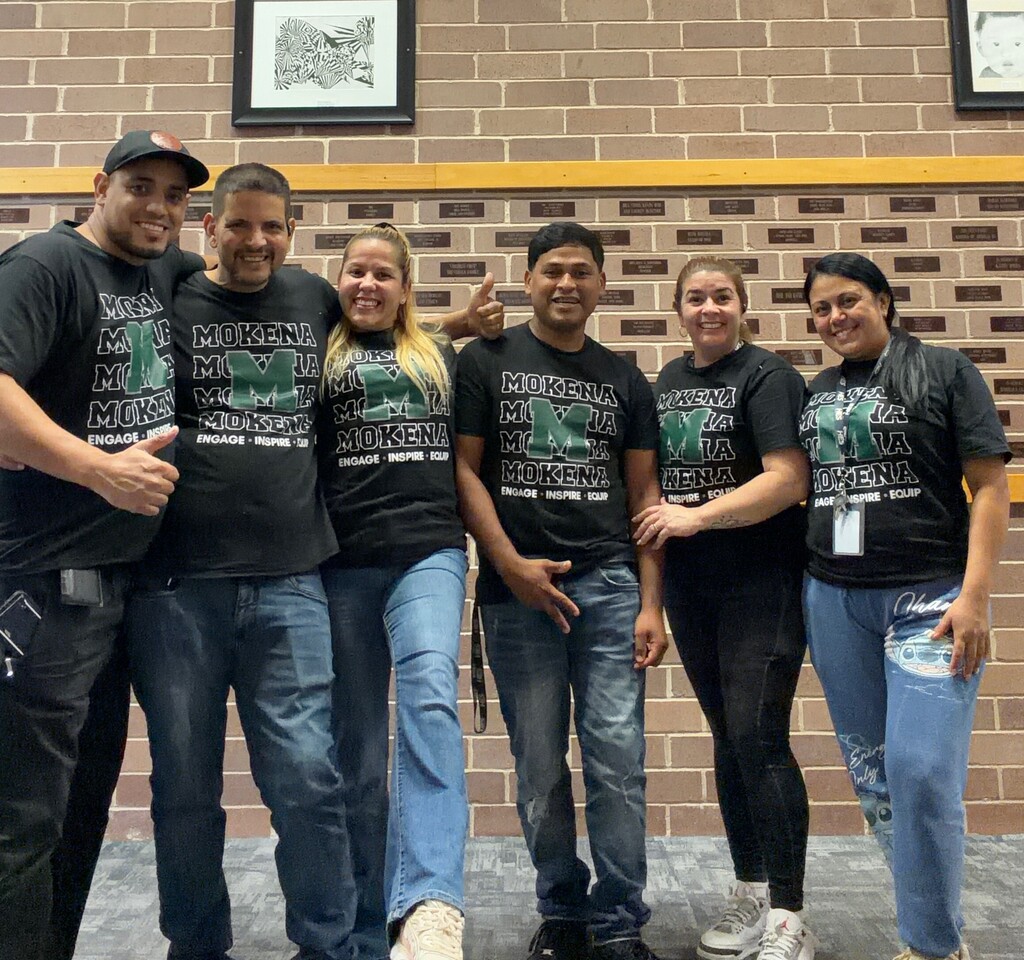 staff members with the district tshirt