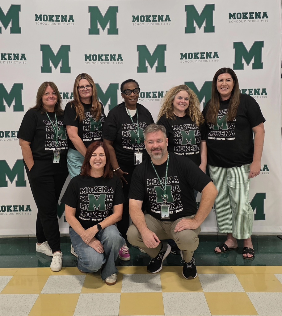 staff members with the district tshirt
