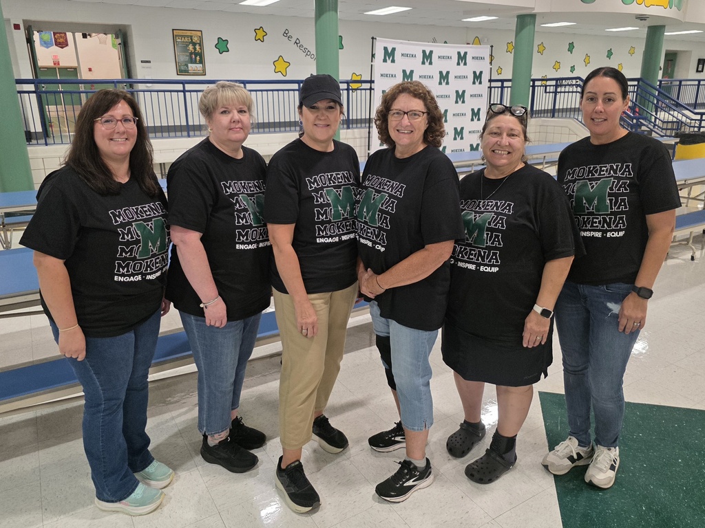 staff members with the district tshirt