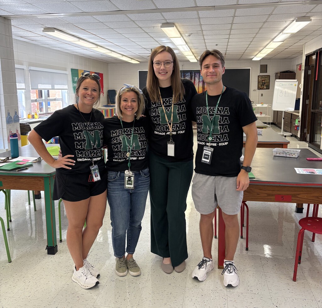 staff members with the district tshirt