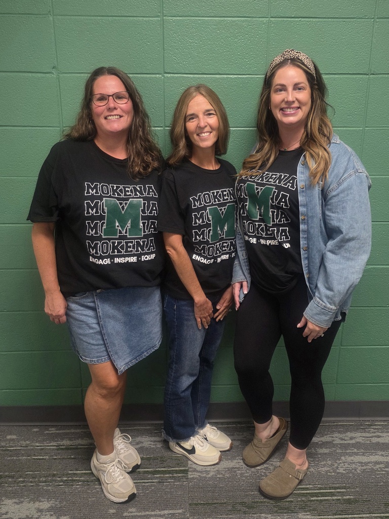 staff members with the district tshirt
