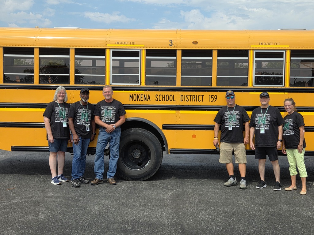 staff members with the district tshirt
