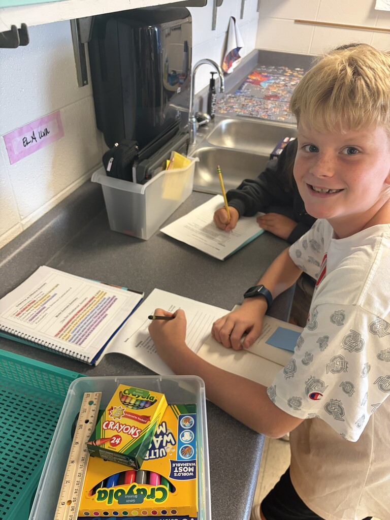 students working on writing summaries together