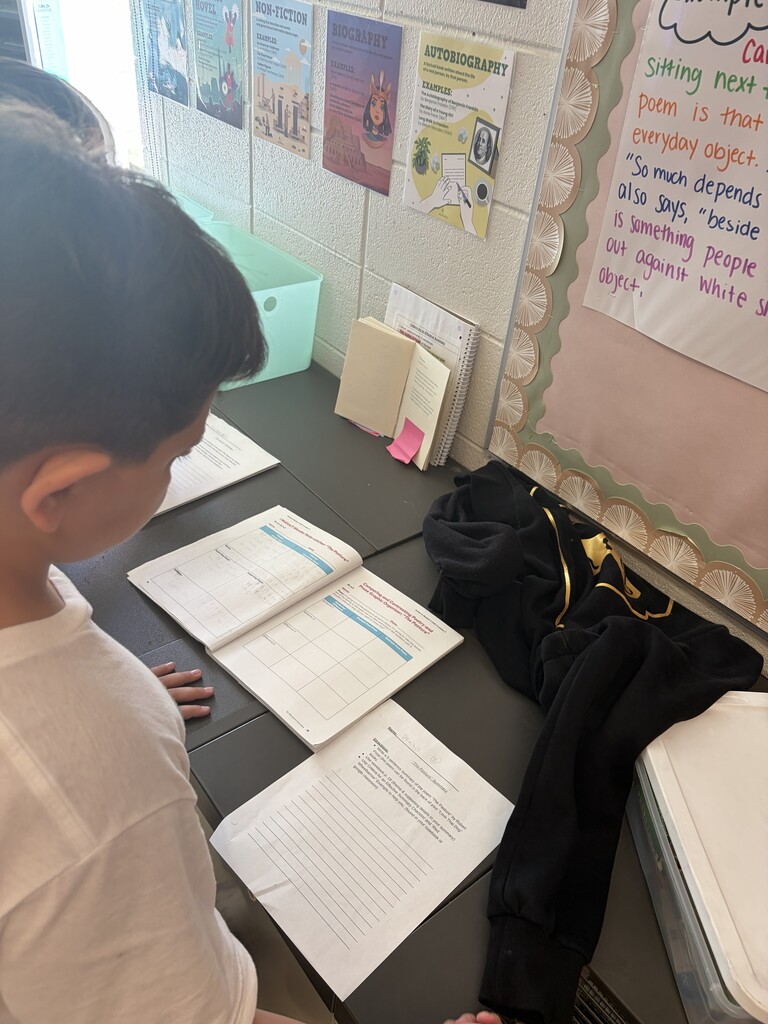 students working on writing summaries together