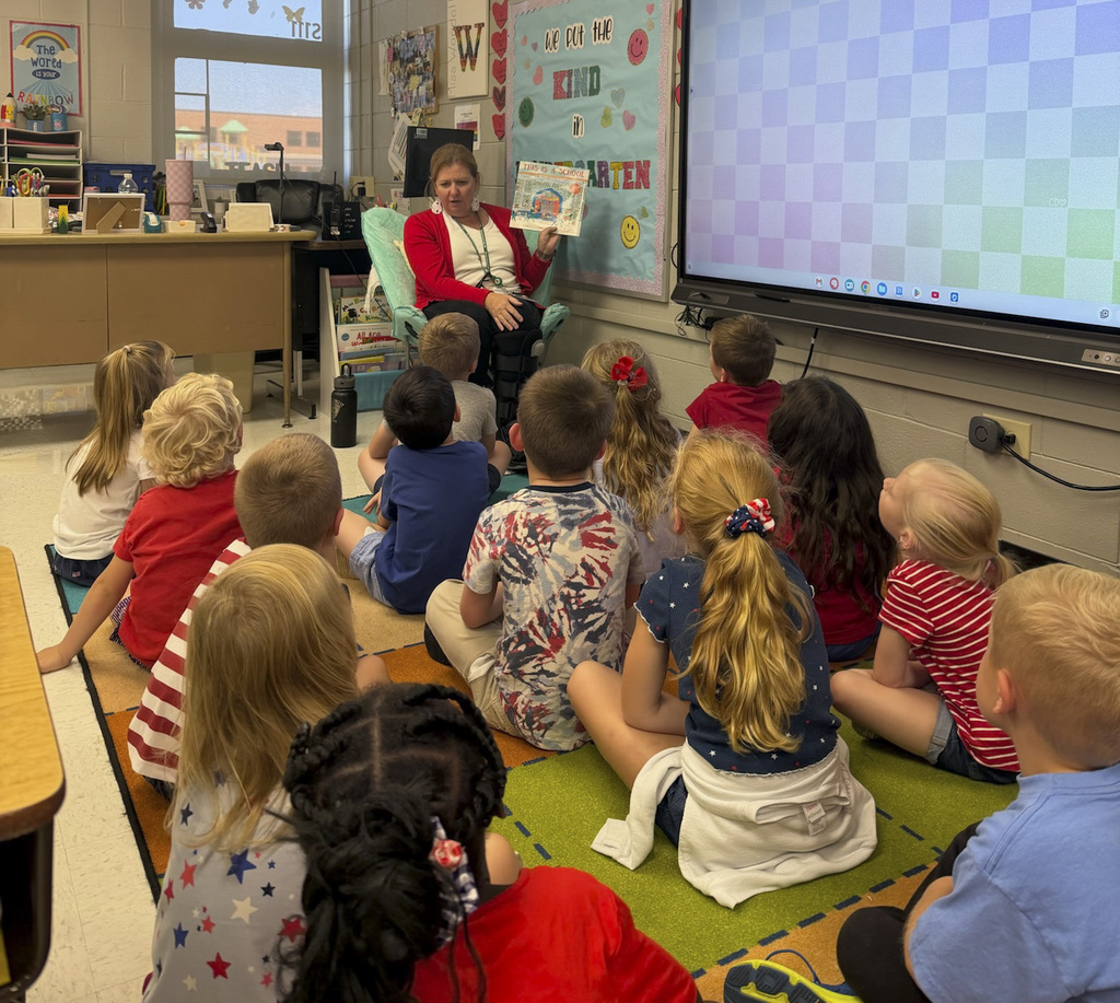 Mrs. Chorley reading to students