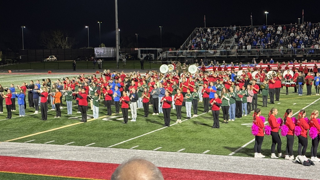 mjhs band students at the football game performing