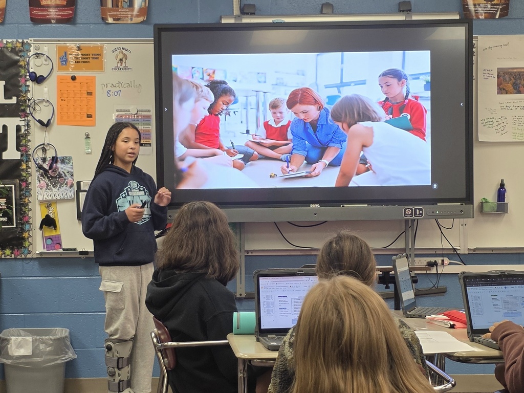 student giving a ted talk to classmates