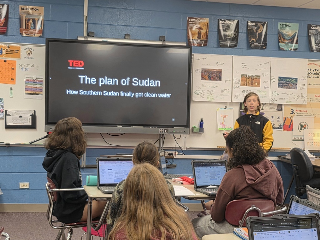 student giving a ted talk to classmates