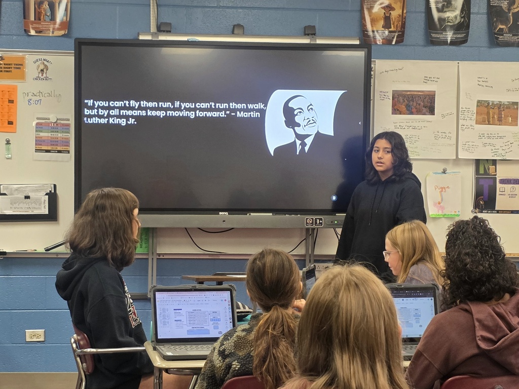student giving a ted talk to classmates