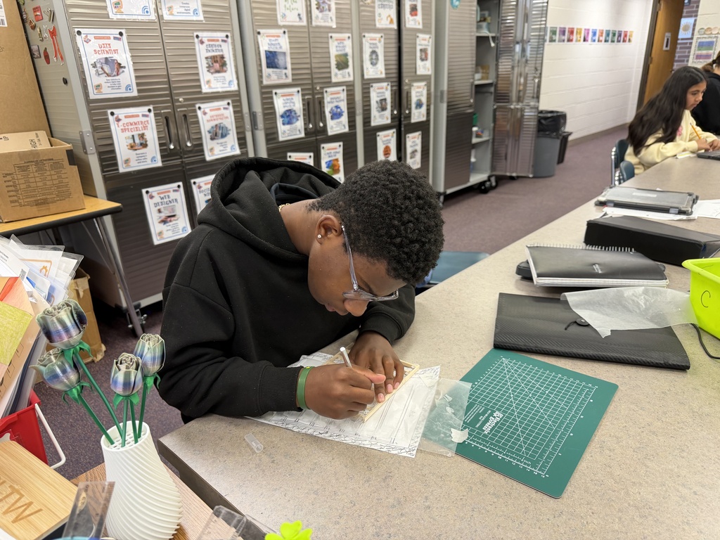 students building and designing a model house