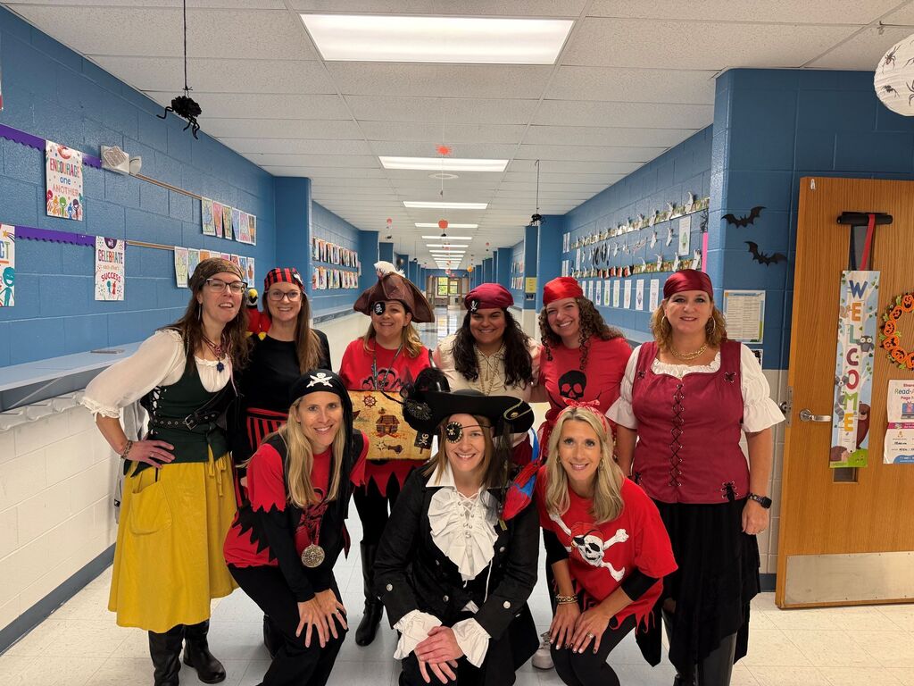 students and teachers wearing costumes