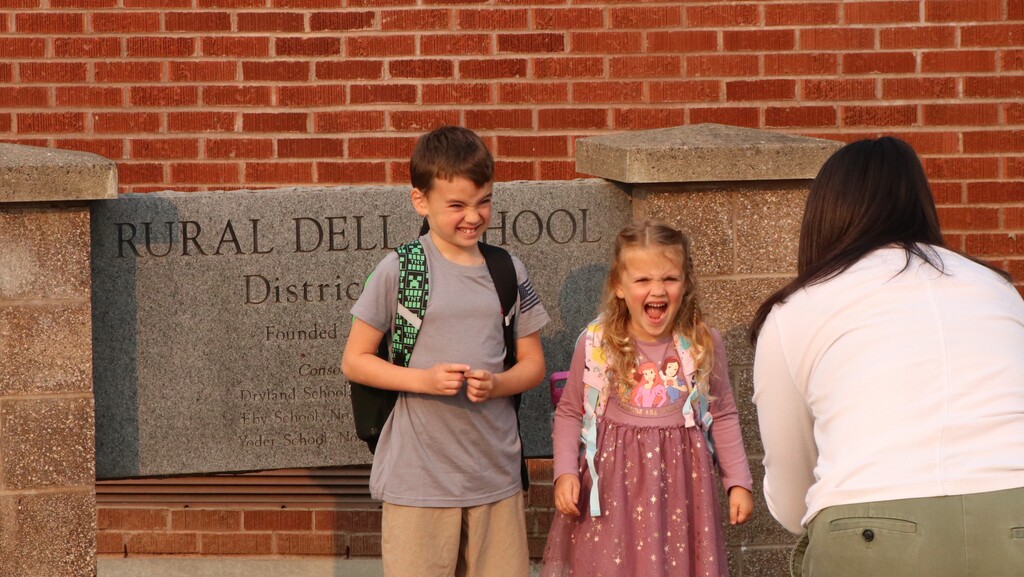 Students posing for parents First Day photos 