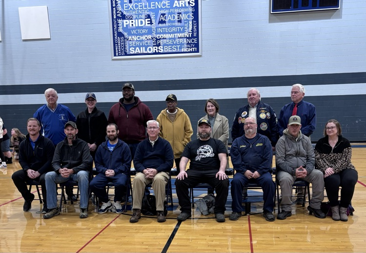 veterans in the gym posing for a photo