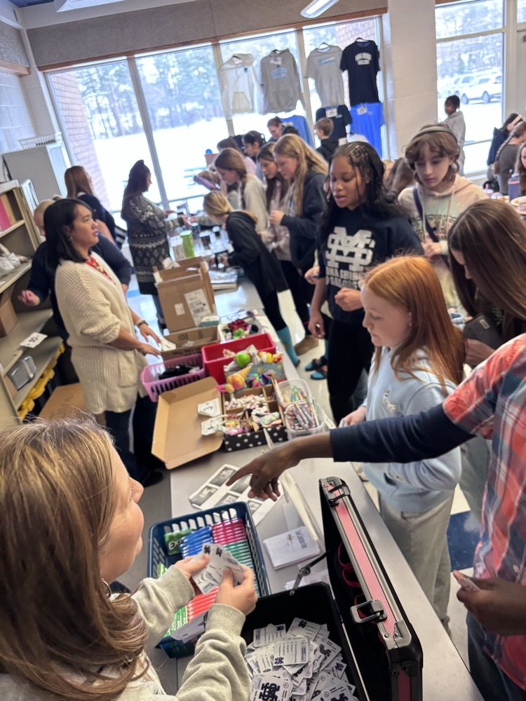 students making purchases at the store