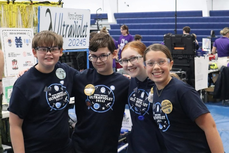 students at their robotics pit station 