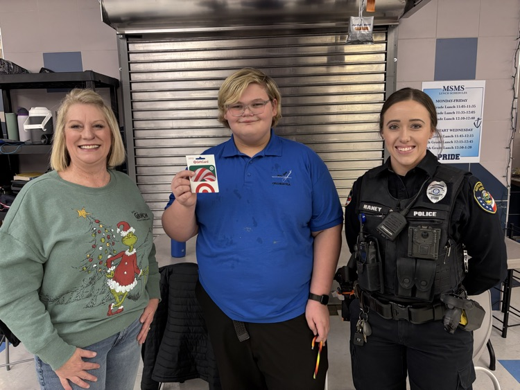 Mrs Jurkas with the winning student and officer Payton