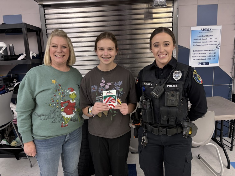 Mrs Jurkas with the winning student and Officer Payton 
