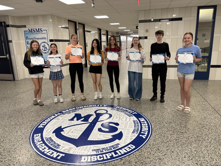 students of the month standing in the foyer of msms 