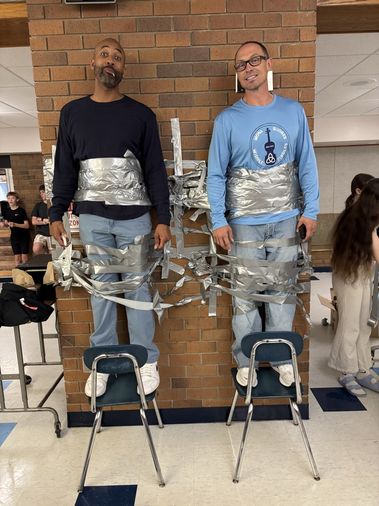 principals duct taped to the wall