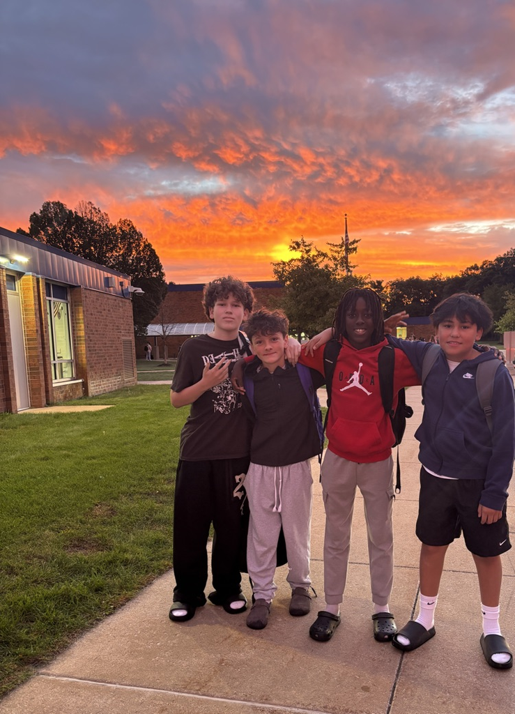 four boys with amazing sunrise in the background 