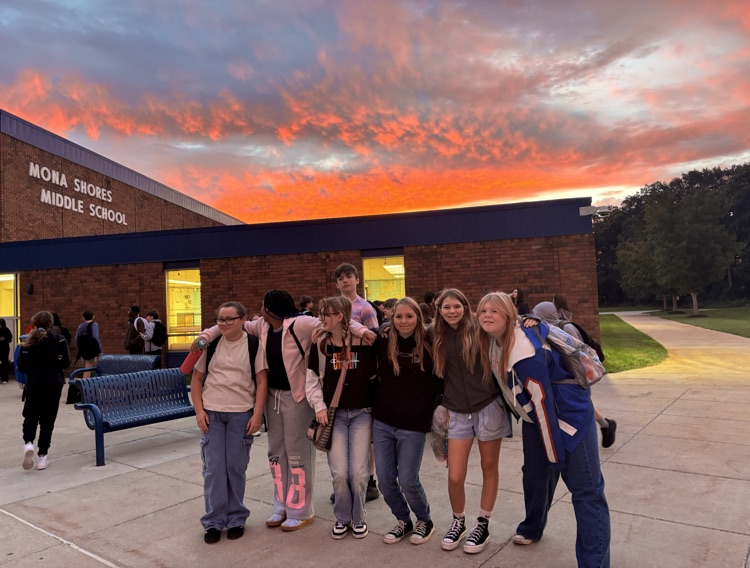 group of students in front of the middle school with beautiful sunrise 
