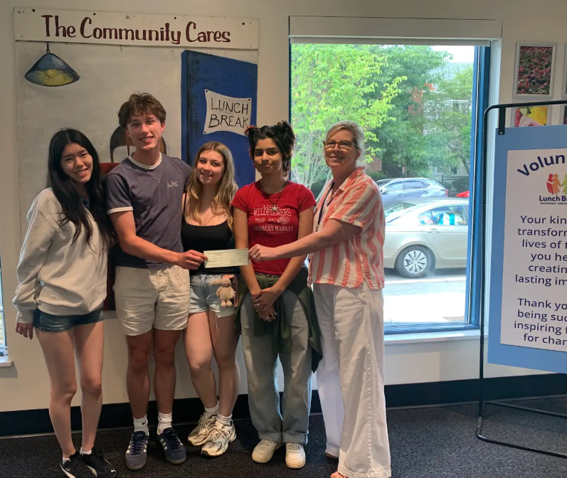 Members of HTHS Deliver Donation to Lunch Break