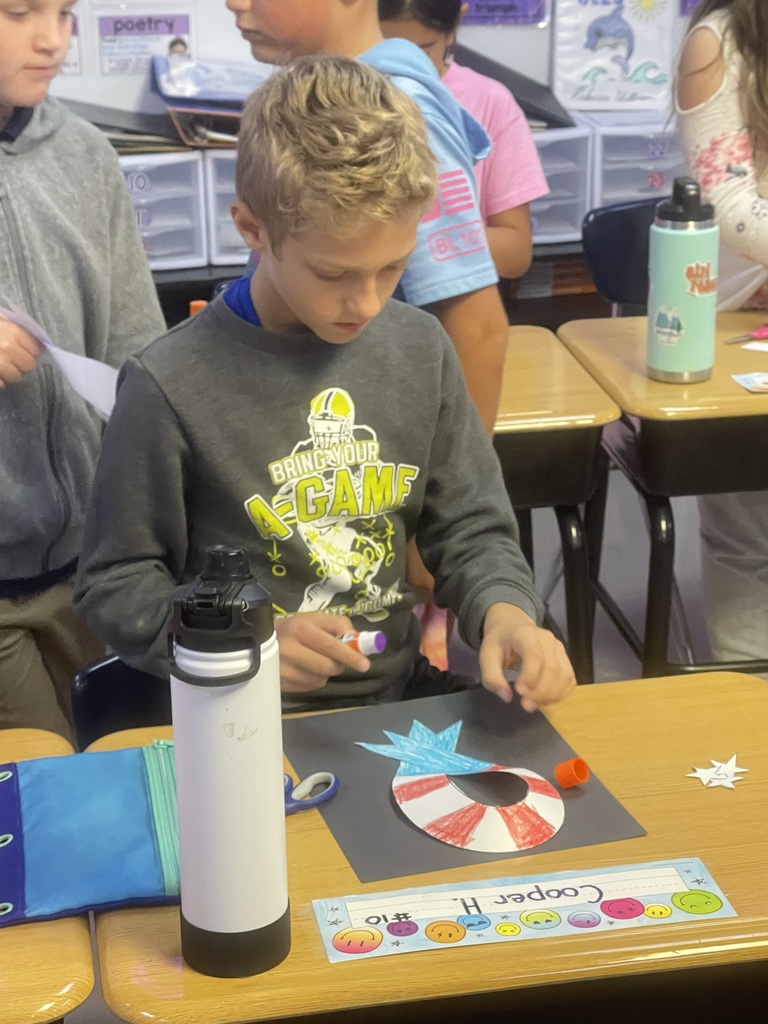 Fourth-grade students created remembrance ribbons in honor of 9/11 today.