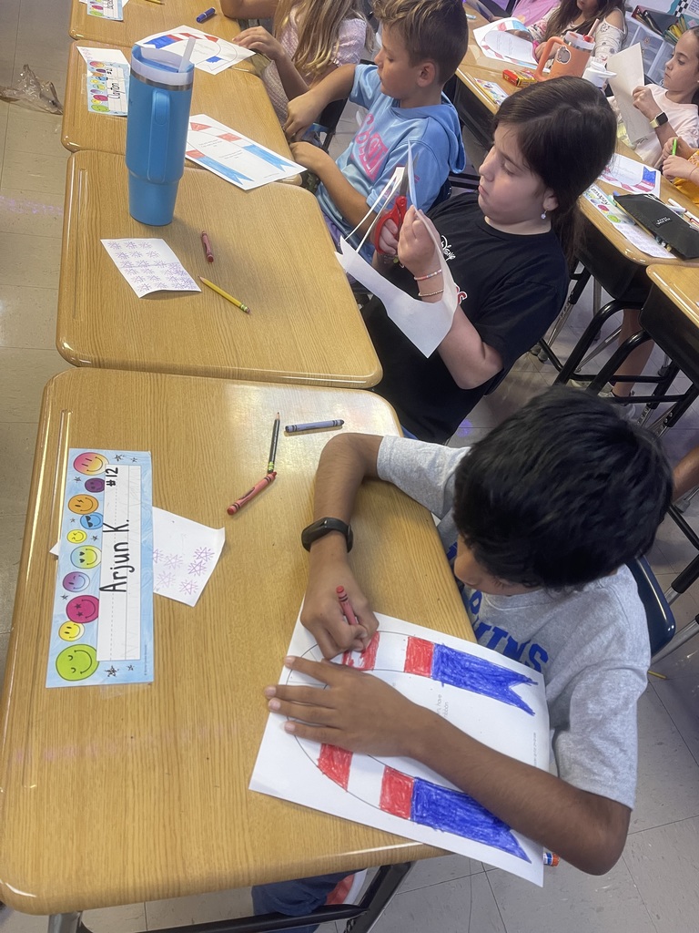 Fourth-grade students created remembrance ribbons in honor of 9/11 today.