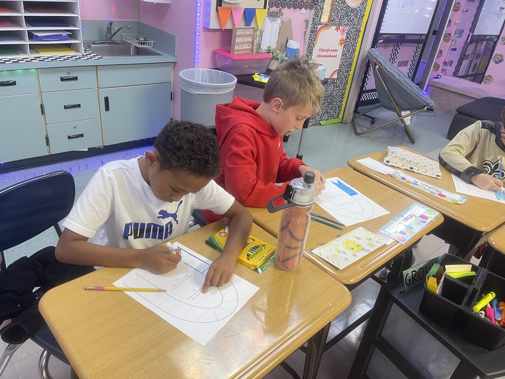 Fourth-grade students created remembrance ribbons in honor of 9/11 today.