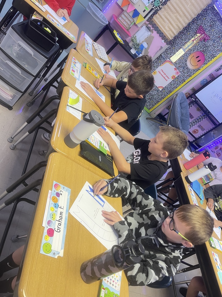 Fourth-grade students created remembrance ribbons in honor of 9/11 today.