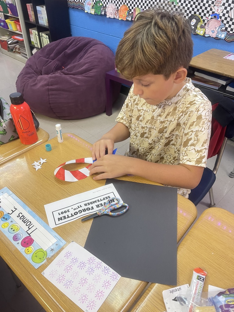 Fourth-grade students created remembrance ribbons in honor of 9/11 today.