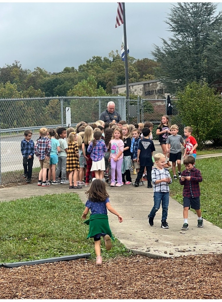  Officer Butch comes out to the playground every day and the Kindergarteners LOVE it.  He hands out officer badge stickers to them.