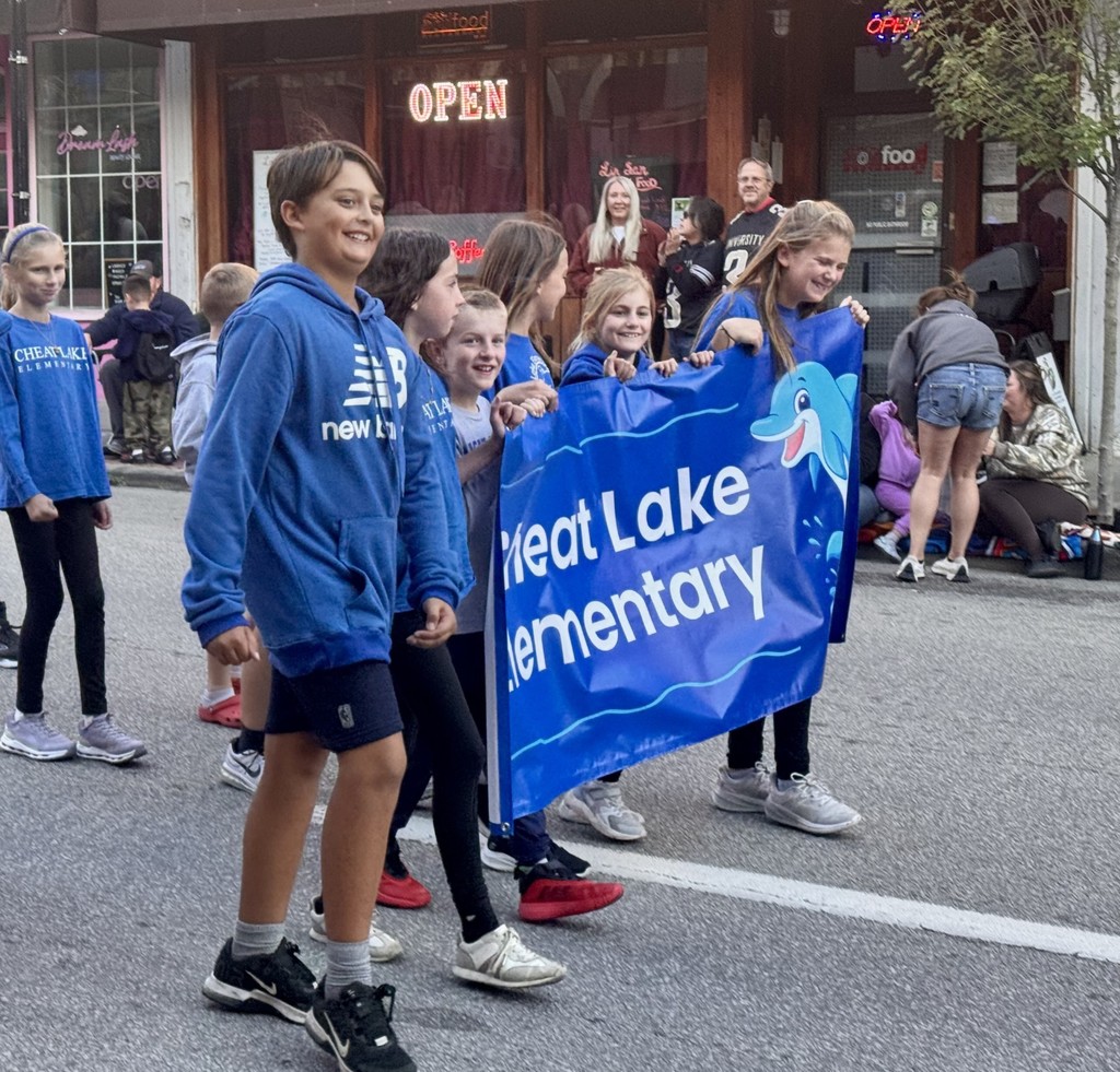 Future Hawks! Cheat Lake Dolphins represent at the UHS 100th Homecoming parade!