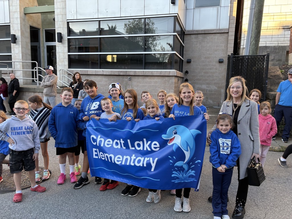 Future Hawks! Cheat Lake Dolphins represent at the UHS 100th Homecoming parade!