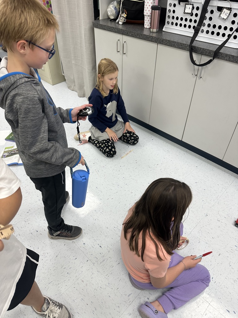 Mrs. Rogers’ 3rd grade class investigates the effects of force and motion through a hands-on experiment using a toy car, tape measure, masking tape, and stopwatch.