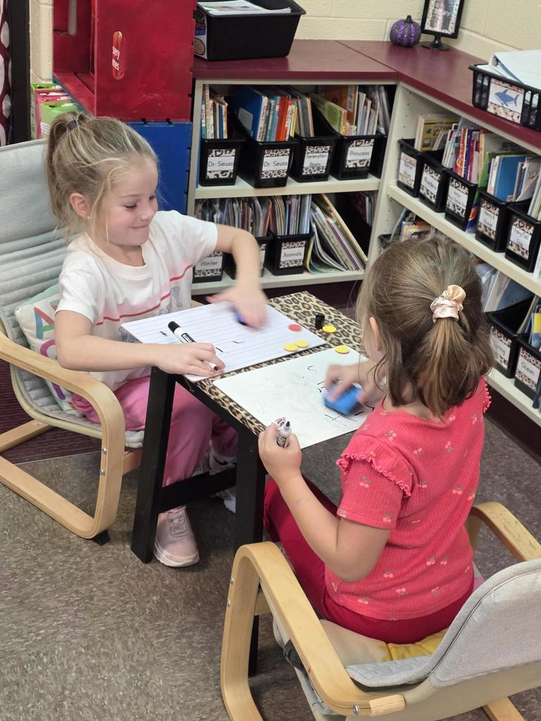 Students in Mrs. Redman's class are actively building their addition skills to 5 through collaborative partner games."