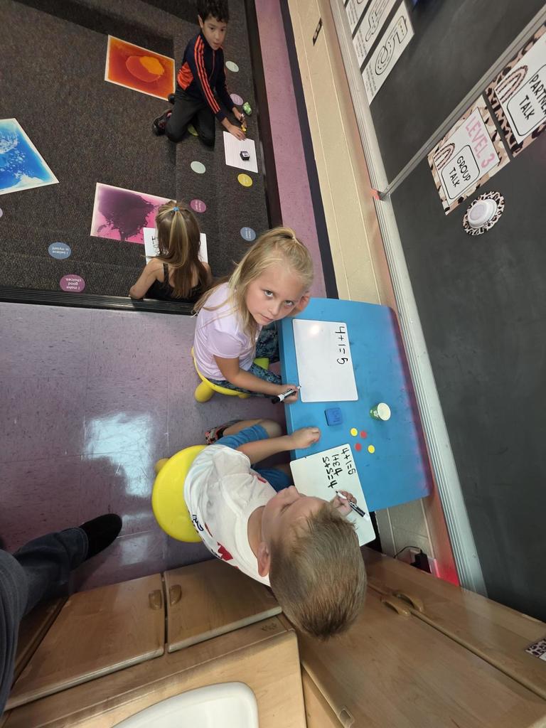 Students in Mrs. Redman's class are actively building their addition skills to 5 through collaborative partner games."