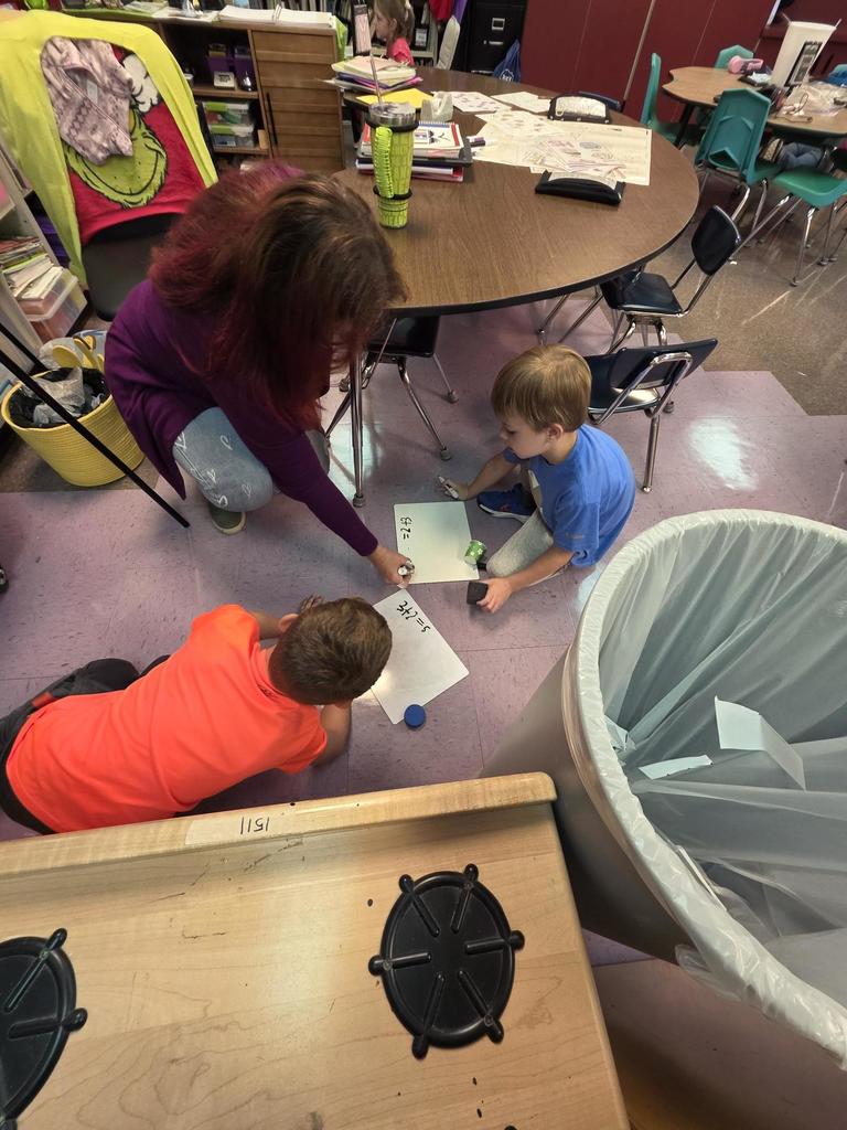 Students in Mrs. Redman's class are actively building their addition skills to 5 through collaborative partner games."