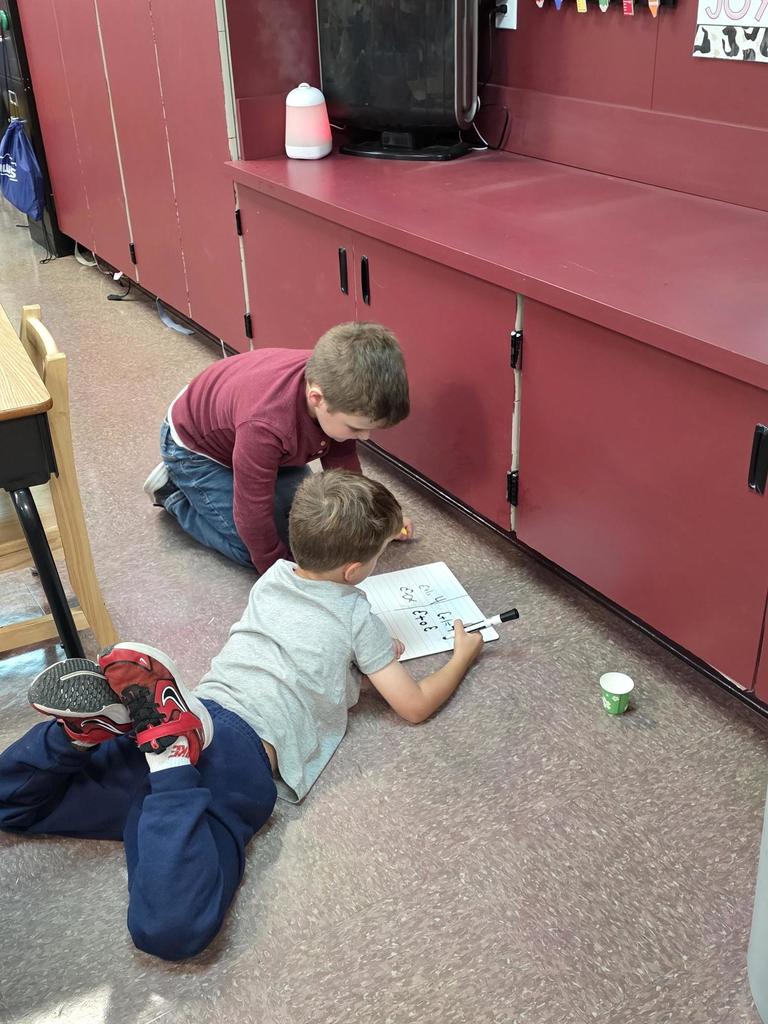 Students in Mrs. Redman's class are actively building their addition skills to 5 through collaborative partner games."