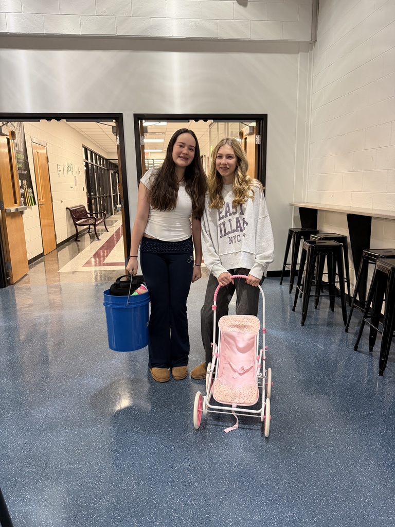 2 girls with bucket and stroller