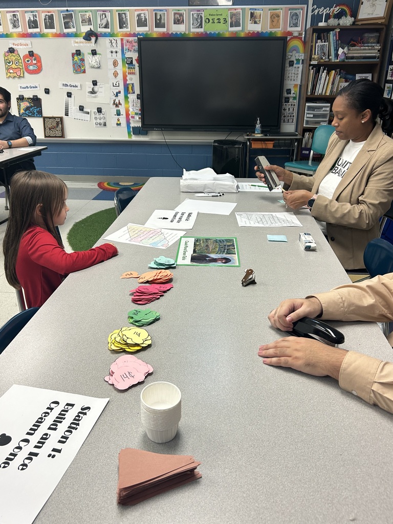 Bankers from United Bank doing a money activity with a student