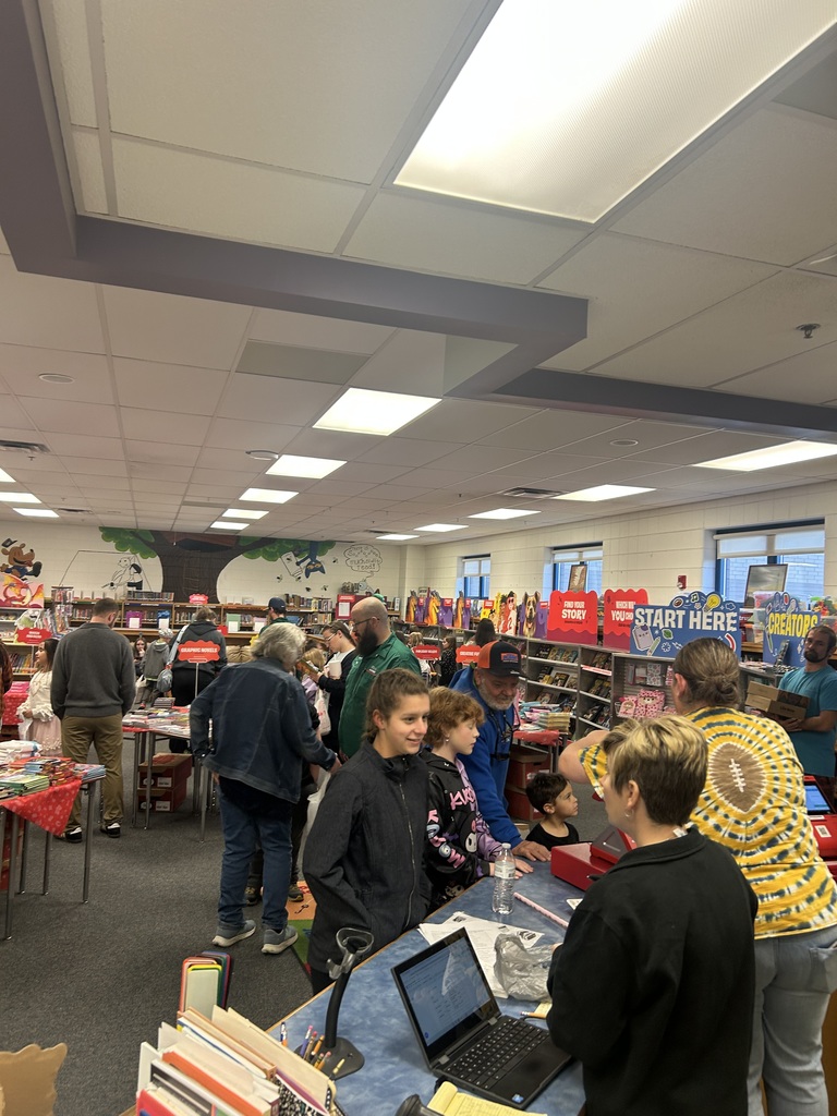 students looking and purchasing books at the Book Fair