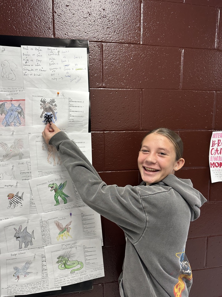 Student holding up something printed from a 3D printer